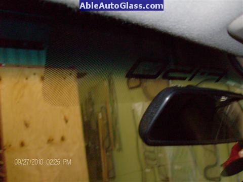 Ford F150 2005-2008 Standard Cab Windshield Repalcement - Inside View of F150 Logo Behind Rear-view Mirror